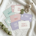 Printable baby milestone cards flat lay in pastel colors